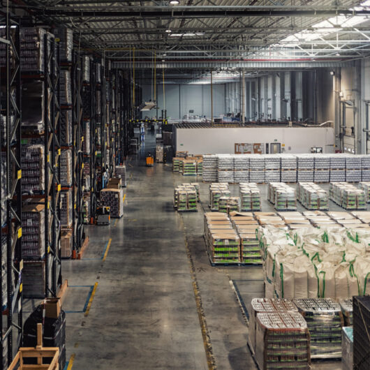 Huge distribution warehouse with high shelves, view from above